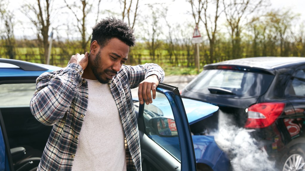 Man with a hurt neck after a car accident